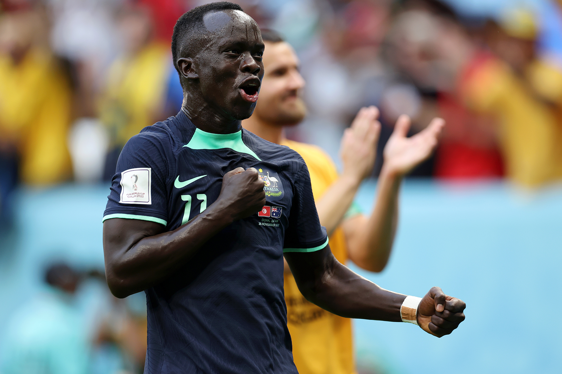 Awer Mabil celebrates after the Socceroos defeated Tunisia at the FIFA World Cup Qatar 2022™